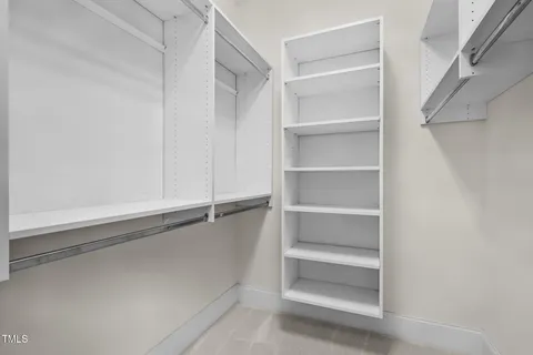 a view of an empty walk in closet