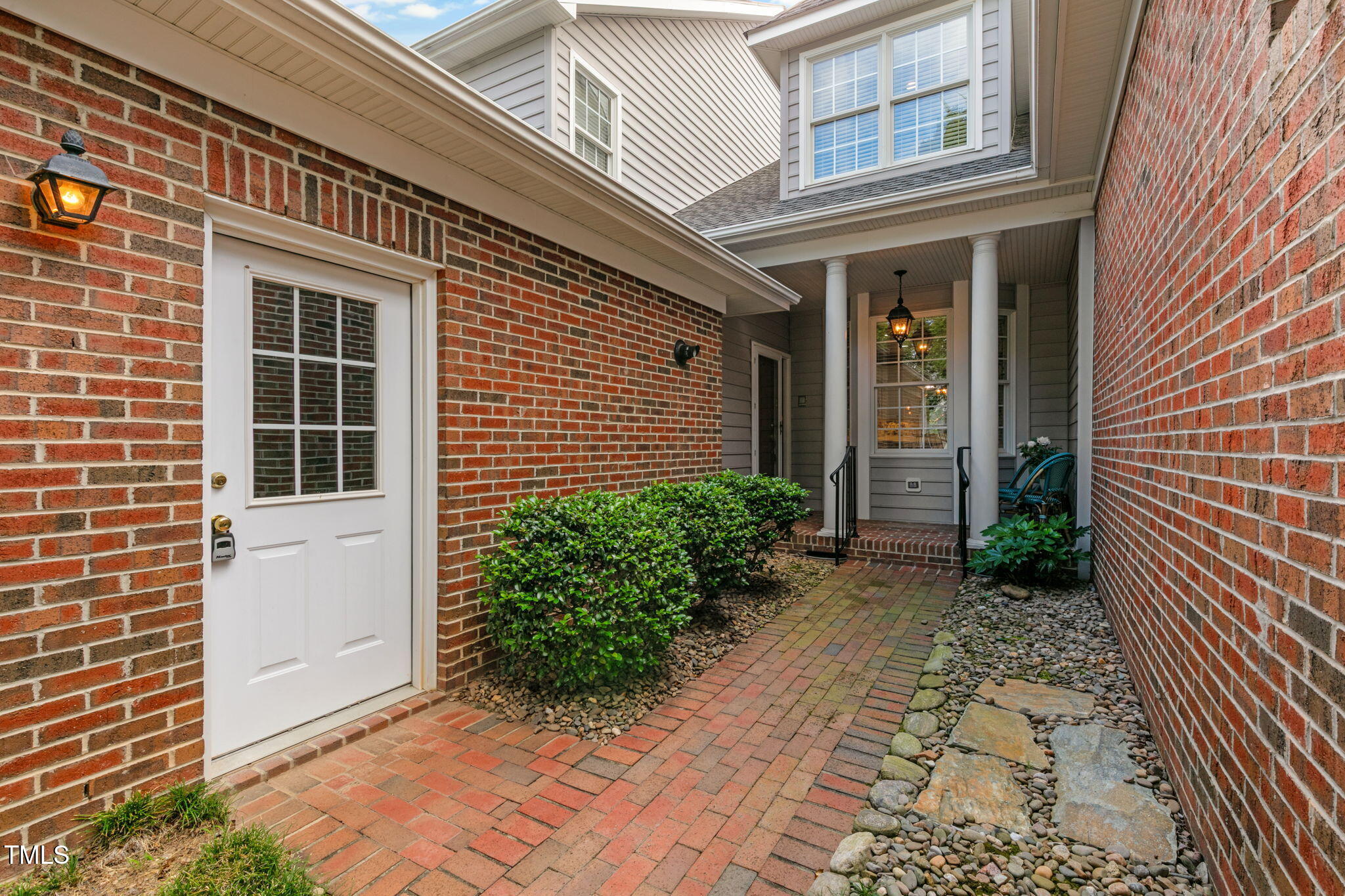 3421 Barron Berkeley Way Raleigh, NC 27612 - Photo 2 of 48 a view of a brick house with plants