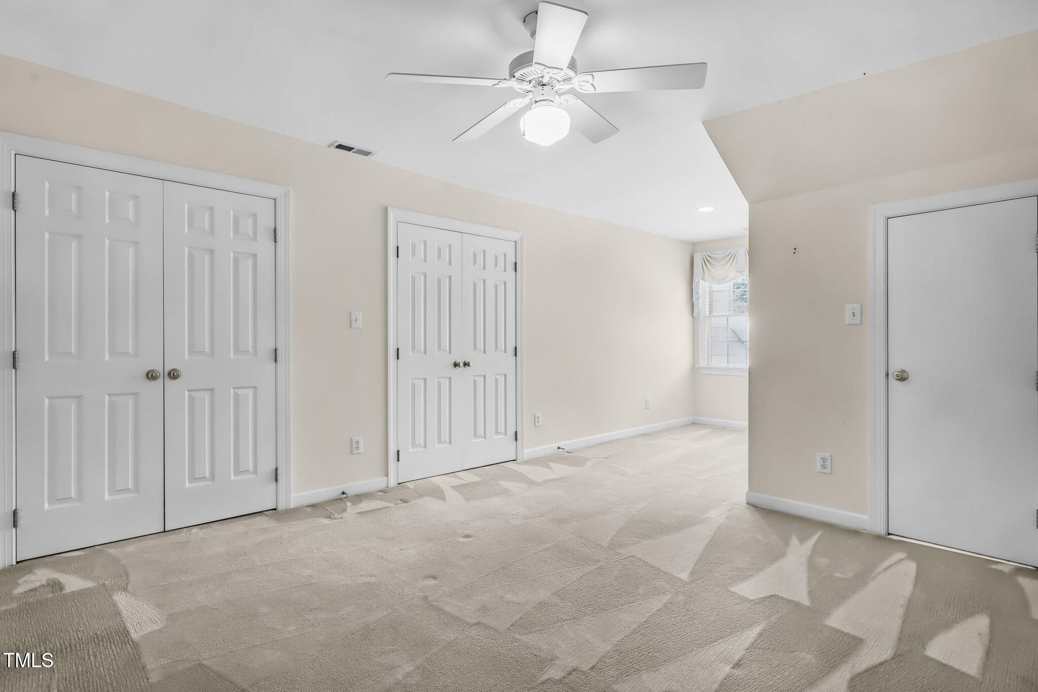 3421 Barron Berkeley Way Raleigh, NC 27612 - Photo 31 of 48 an empty room with fan and a ceiling fan