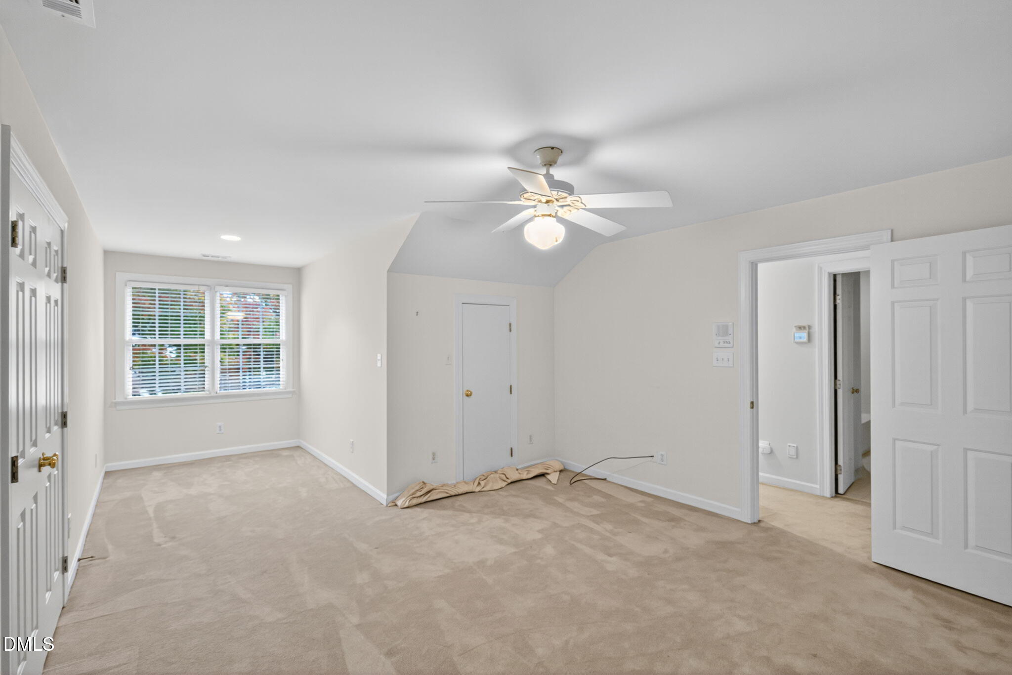 3421 Barron Berkeley Way Raleigh, NC 27612 - Photo 32 of 48 an empty room with windows and fan
