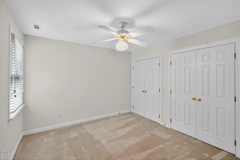 a view of an empty room with wooden walls