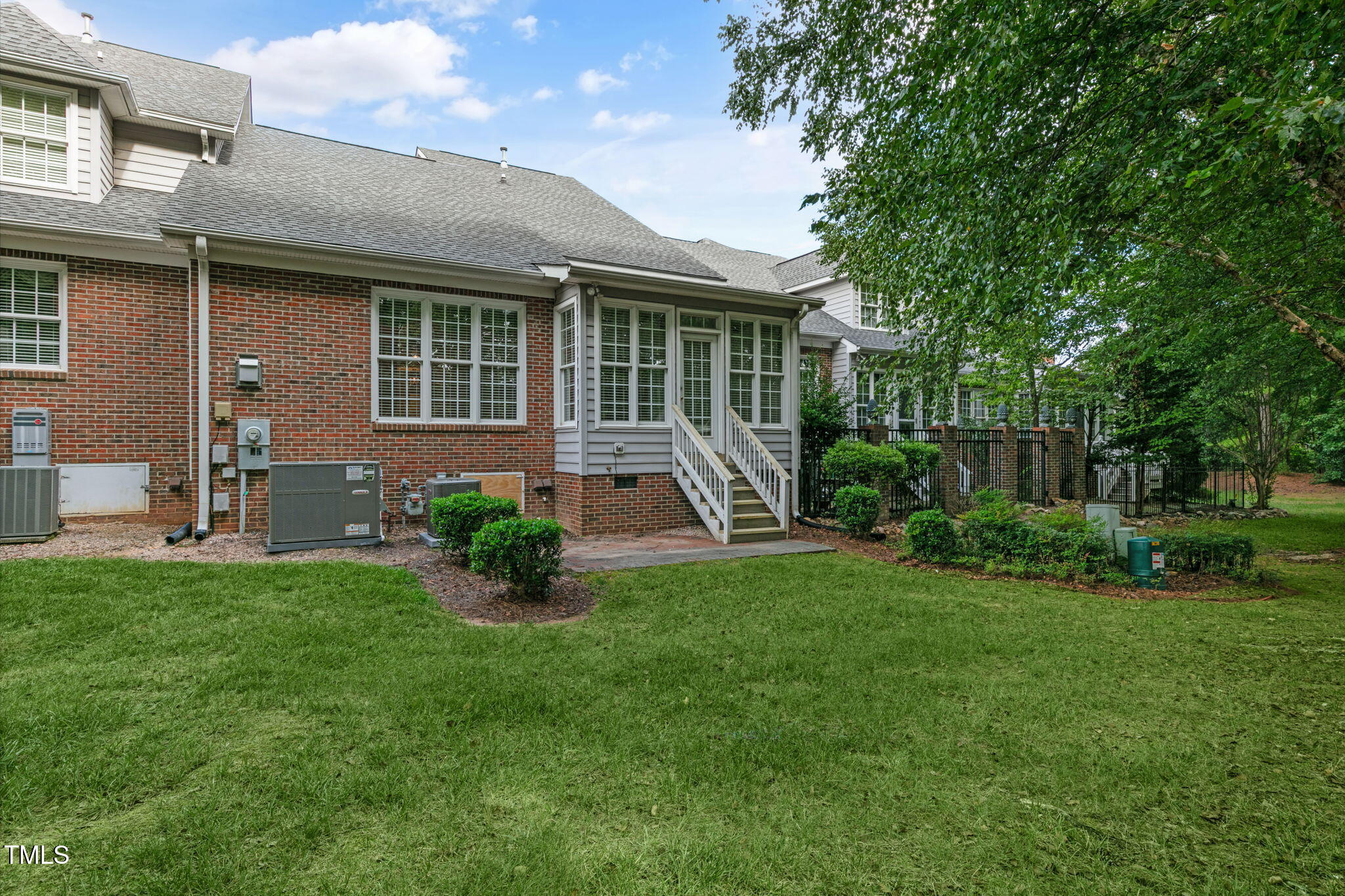 3421 Barron Berkeley Way Raleigh, NC 27612 - Photo 40 of 48 a front view of a house with yard and outdoor seating