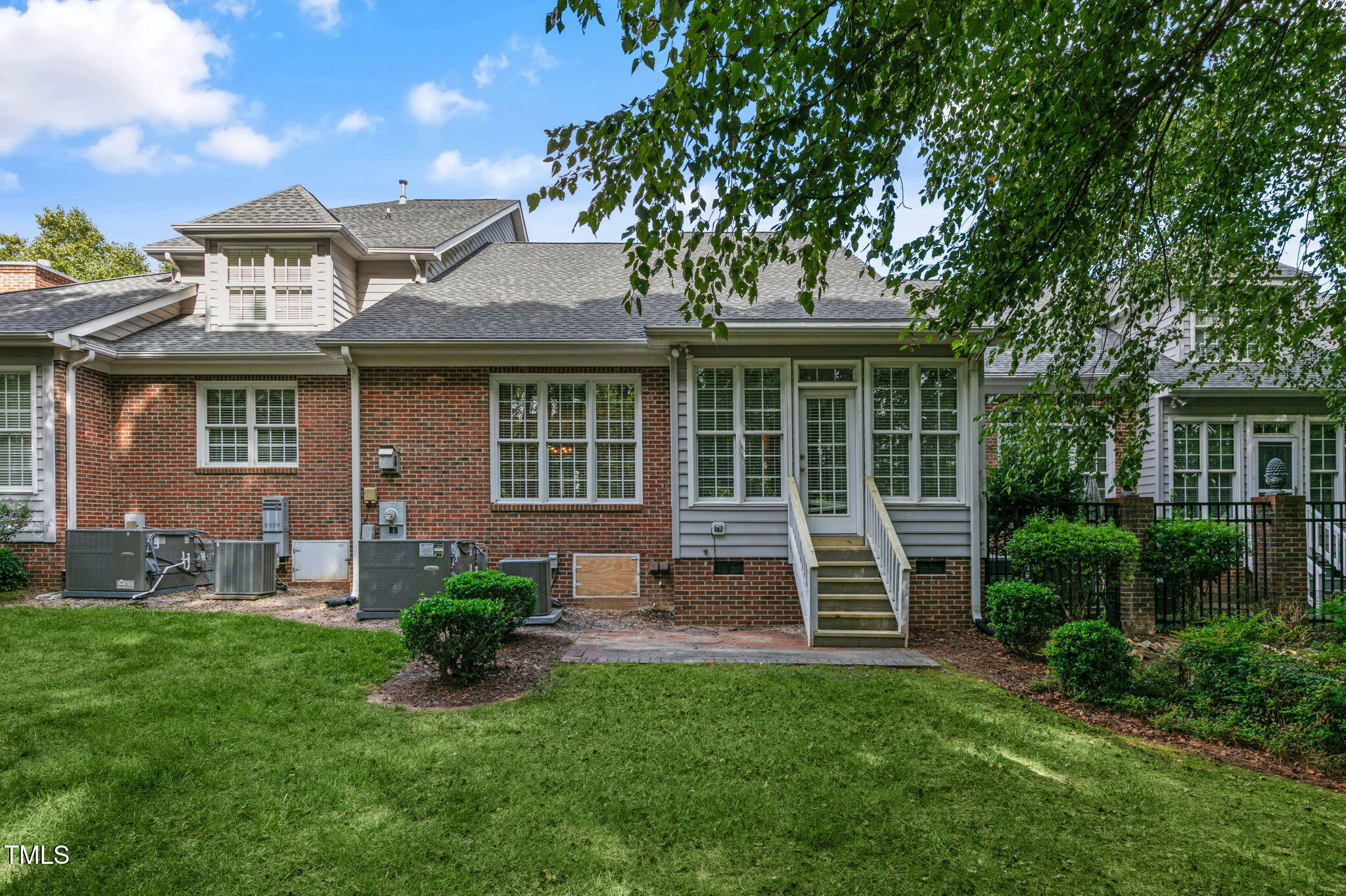 3421 Barron Berkeley Way Raleigh, NC 27612 - Photo 41 of 48 a front view of a house with a garden