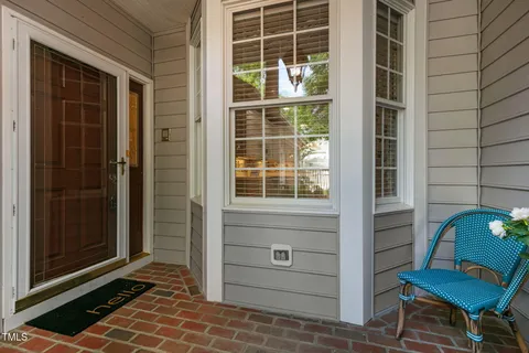 a porch with a seating space