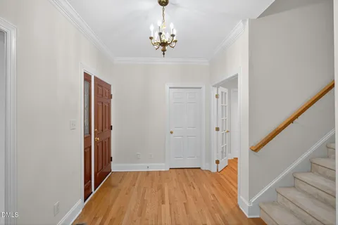 a view of a door and chair in front of door