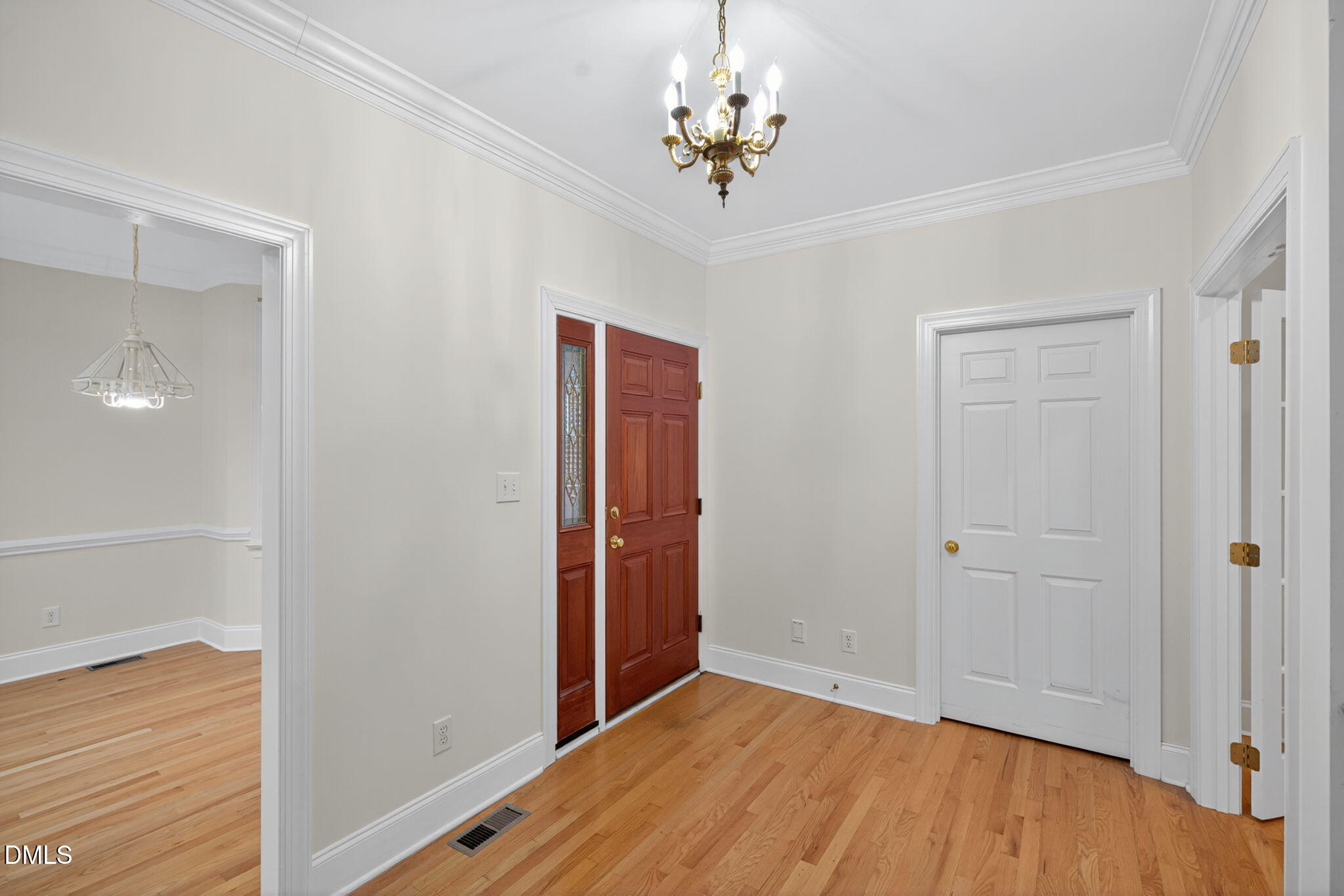 3421 Barron Berkeley Way Raleigh, NC 27612 - Photo 8 of 48 wooden floor in an empty room with a window