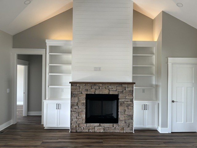 8246 Aedc Road Estill Springs, TN 37330 - Photo 54 of 55 a living room with a fireplace and wooden floor