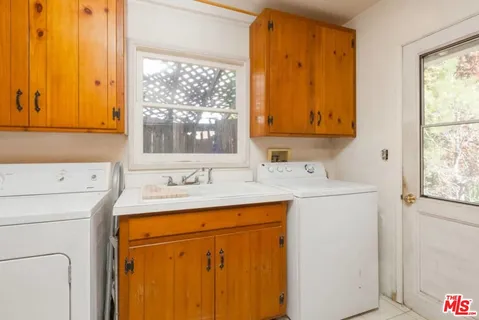 a utility room with a window dryer and washer