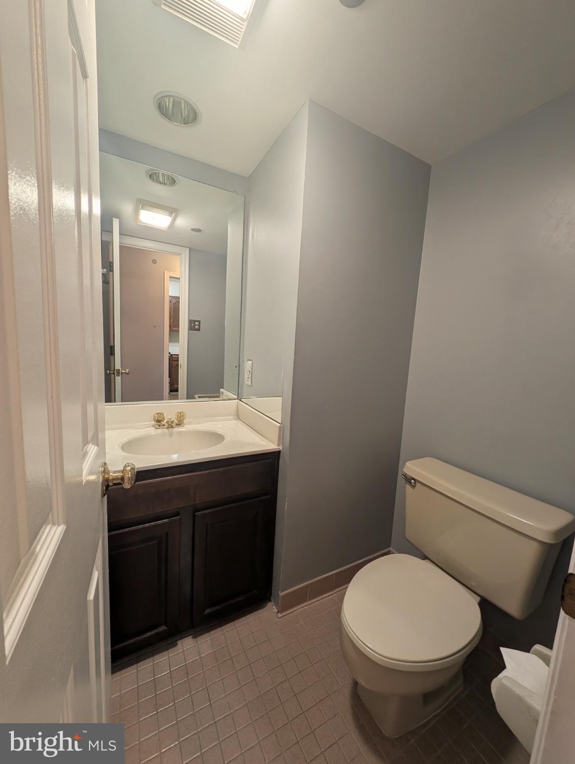 1301 North Courthouse Road, Unit 1202 Arlington, VA 22201 - Photo 6 of 17 a bathroom with a toilet sink and mirror