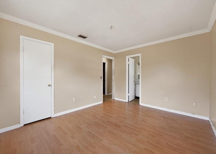 22164 Southwest 65th Terrace Boca Raton, FL 33428 - Photo 18 of 20 a view of an empty room with wooden floor