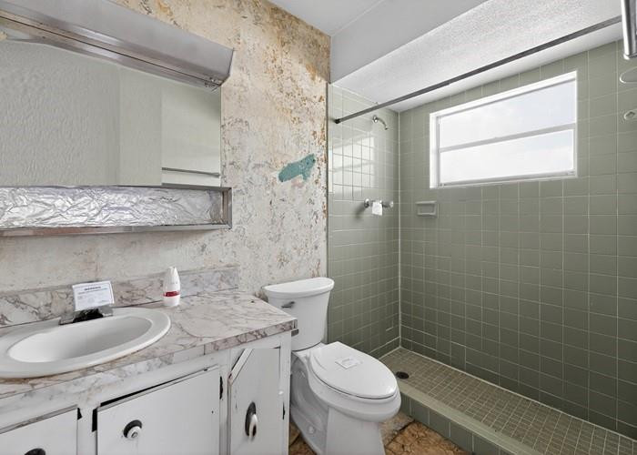 22164 Southwest 65th Terrace Boca Raton, FL 33428 - Photo 19 of 20 a bathroom with a sink toilet and shower