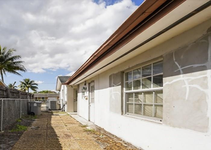 22164 Southwest 65th Terrace Boca Raton, FL 33428 - Photo 2 of 20 a front view of a house with a yard