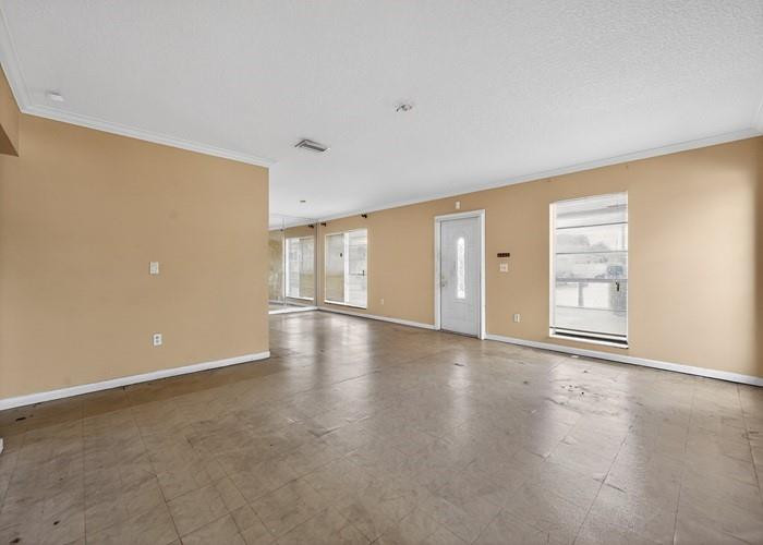 22164 Southwest 65th Terrace Boca Raton, FL 33428 - Photo 6 of 20 a view of an empty room with a window and wooden floor
