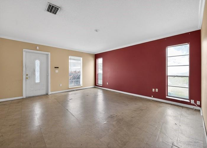 22164 Southwest 65th Terrace Boca Raton, FL 33428 - Photo 8 of 20 an empty room with wooden floor and windows