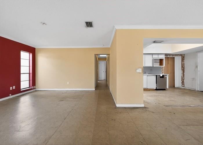22164 Southwest 65th Terrace Boca Raton, FL 33428 - Photo 9 of 20 an empty room with windows and cabinet