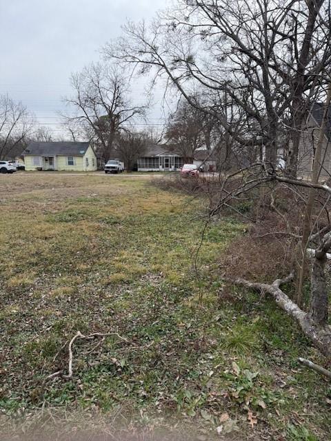 818 West 9th Street Bonham, TX 75418 - Photo 3 of 8 a backyard of a house with lots of green space
