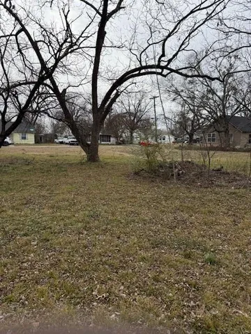 a view of lake with a yard