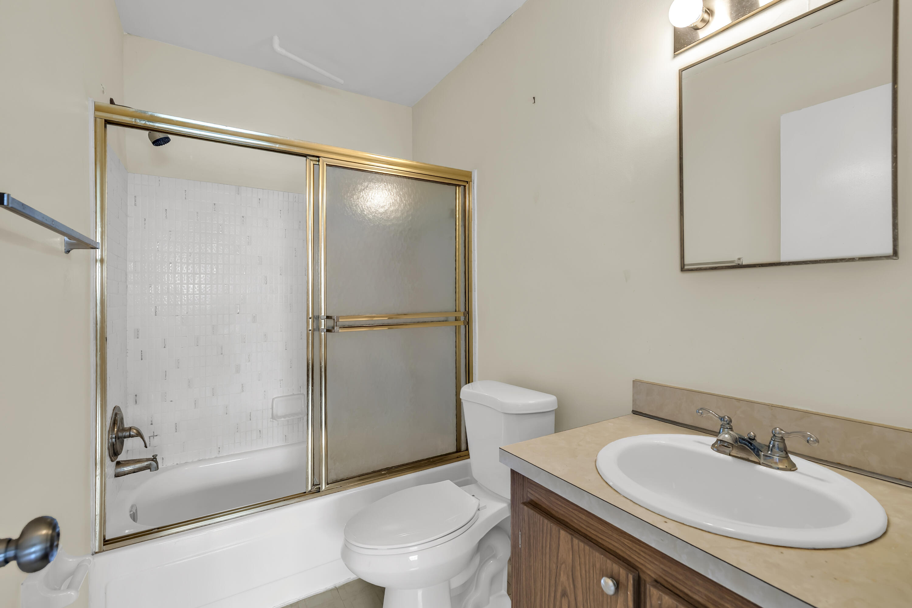 298 Southwest 6th Street, Unit 204 Boca Raton, FL 33432 - Photo 18 of 22 a bathroom with a sink toilet and shower