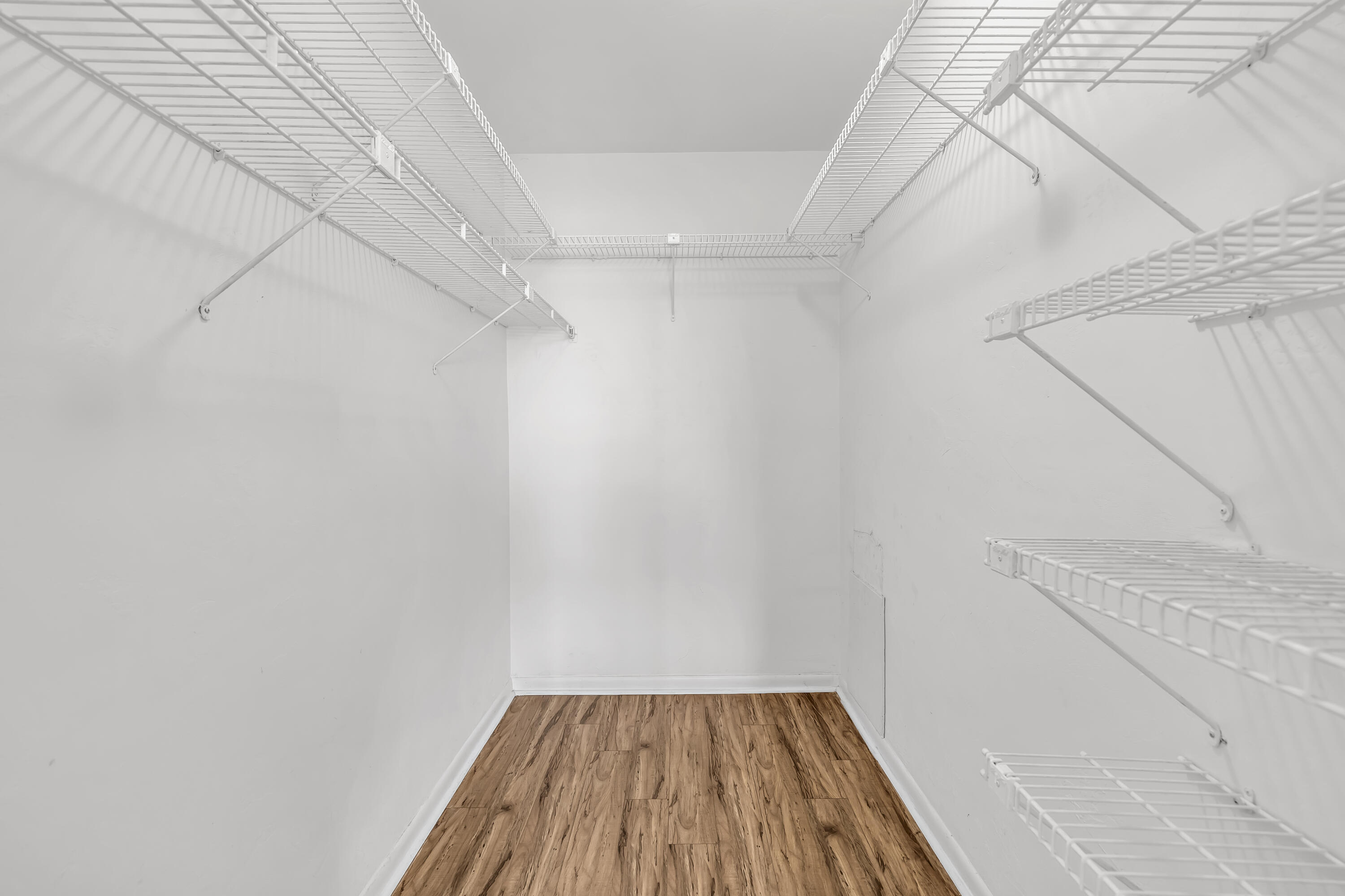 298 Southwest 6th Street, Unit 204 Boca Raton, FL 33432 - Photo 19 of 22 a view of a room with wooden floor