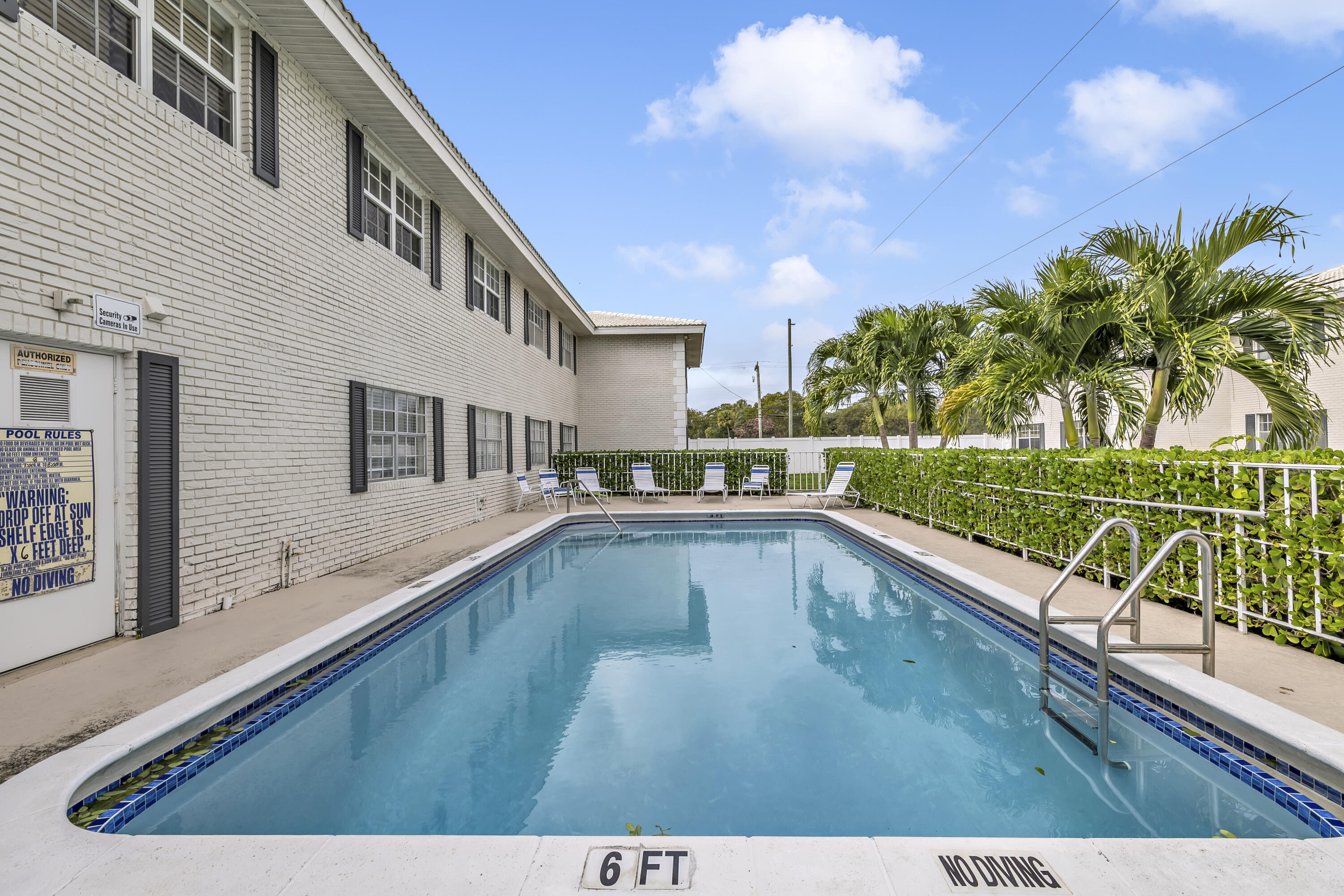 298 Southwest 6th Street, Unit 204 Boca Raton, FL 33432 - Photo 3 of 22 a view of a house with pool