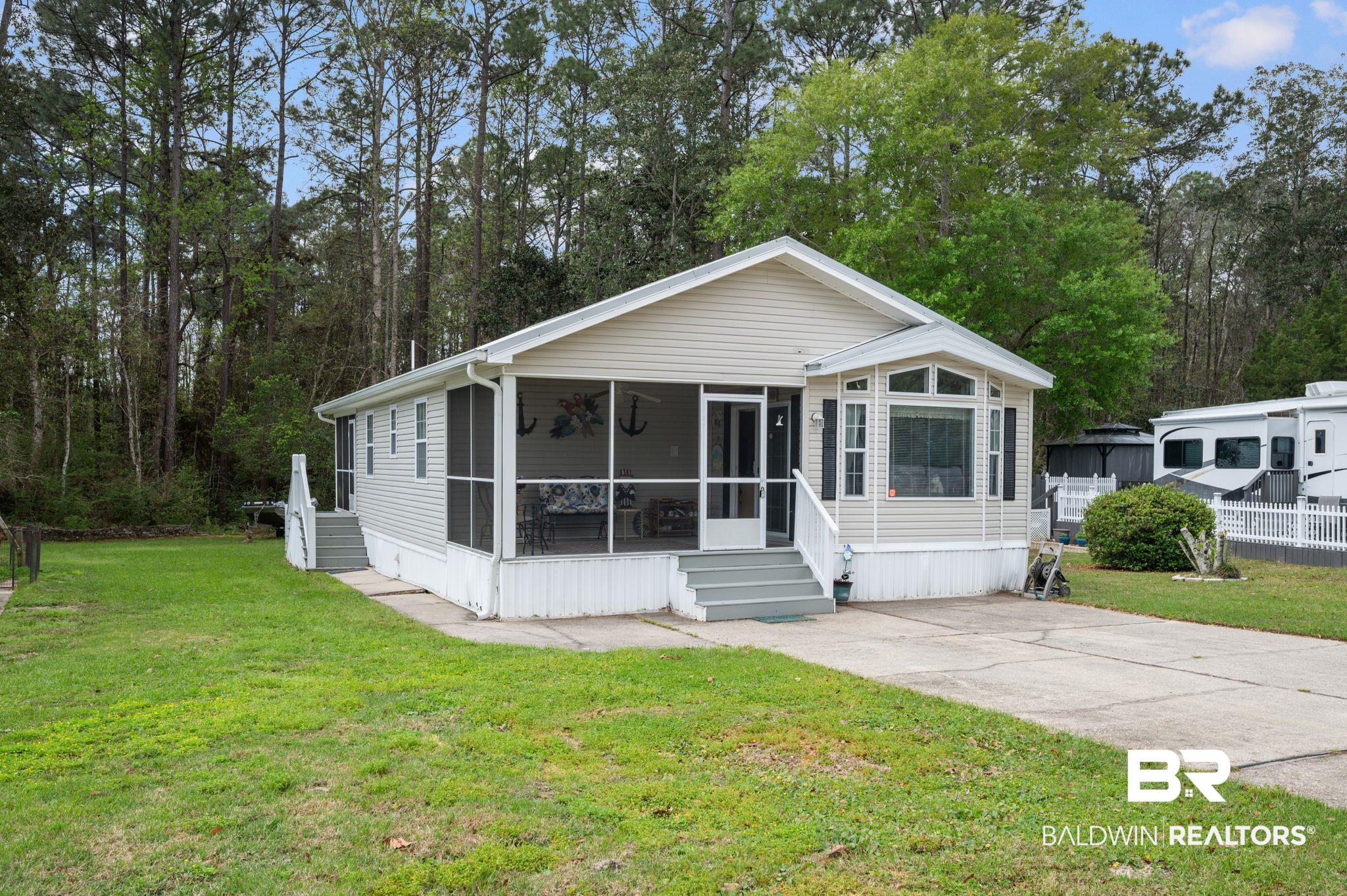 24711 County Road 20, Unit A11 Elberta, AL 36530 - Photo 2 of 35 Manufactured / mobile home featuring a sunroom and a front yard