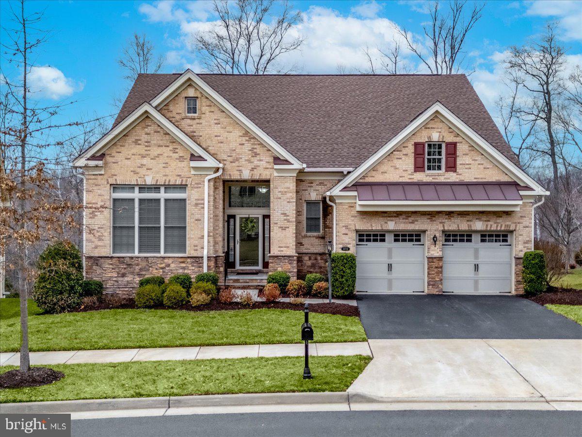 13712 Long Ridge Drive Gainesville, VA 20155 - Photo 1 of 62 a front view of a house with a yard and potted plants