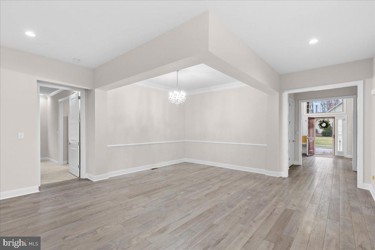 13712 Long Ridge Drive Gainesville, VA 20155 - Photo 17 of 62 an empty room with wooden floor and windows