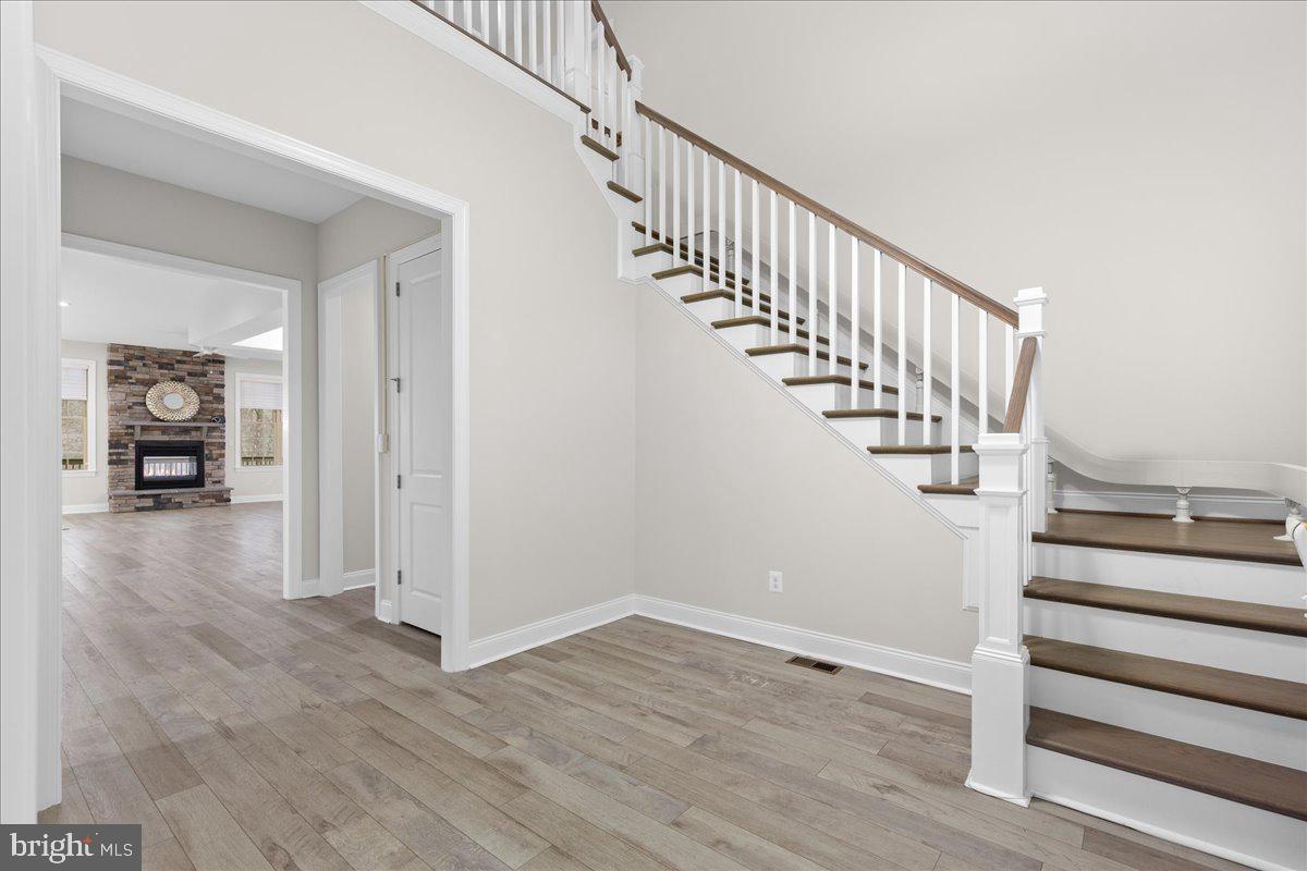 13712 Long Ridge Drive Gainesville, VA 20155 - Photo 2 of 62 a view of entryway and hall with wooden floor