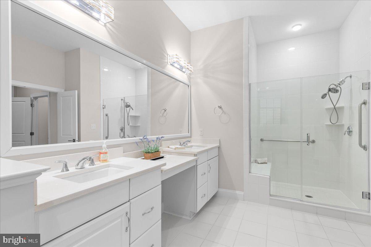 13712 Long Ridge Drive Gainesville, VA 20155 - Photo 23 of 62 a bathroom with a sink double vanity and shower