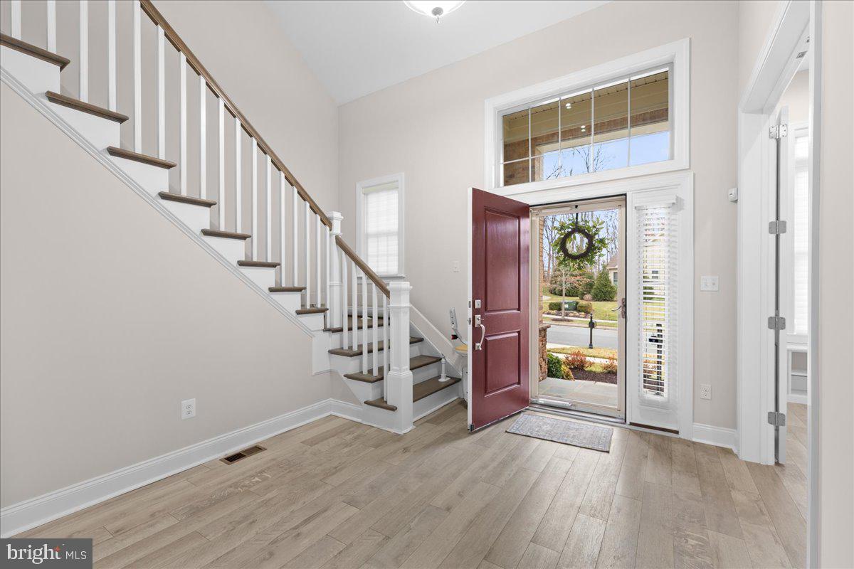 13712 Long Ridge Drive Gainesville, VA 20155 - Photo 3 of 62 a view of entryway and hall with wooden floor