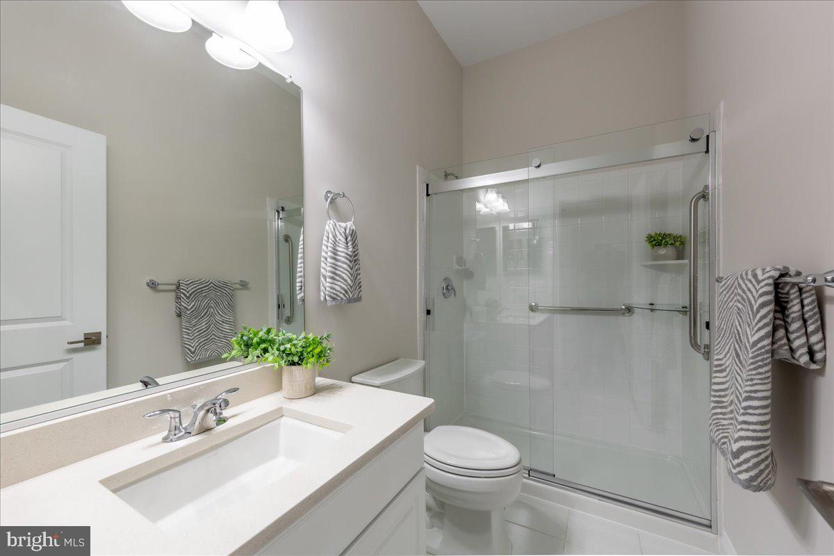 13712 Long Ridge Drive Gainesville, VA 20155 - Photo 31 of 62 a bathroom with a sink a toilet and shower