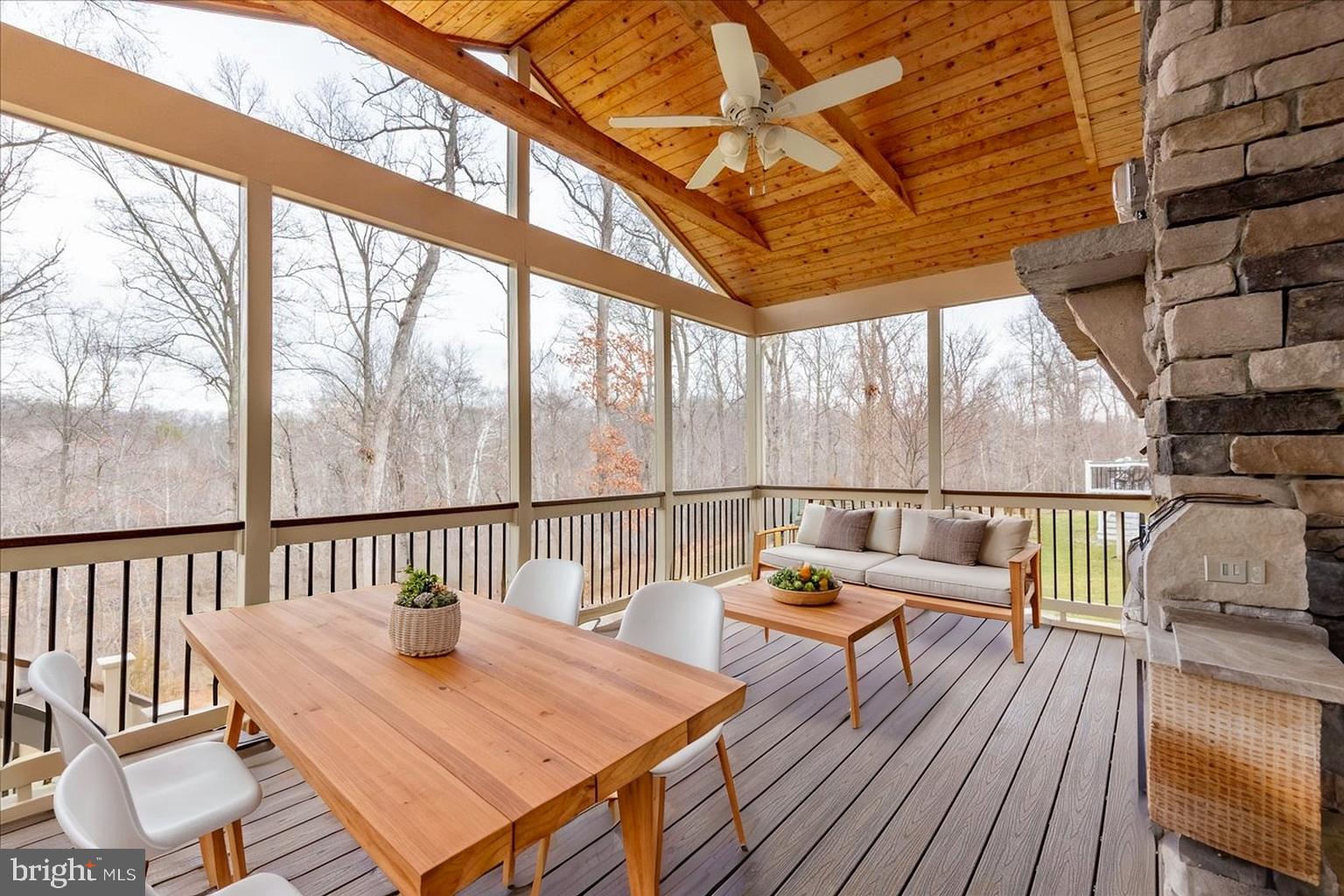 13712 Long Ridge Drive Gainesville, VA 20155 - Photo 33 of 62 a view of balcony with wooden floor and outdoor seating