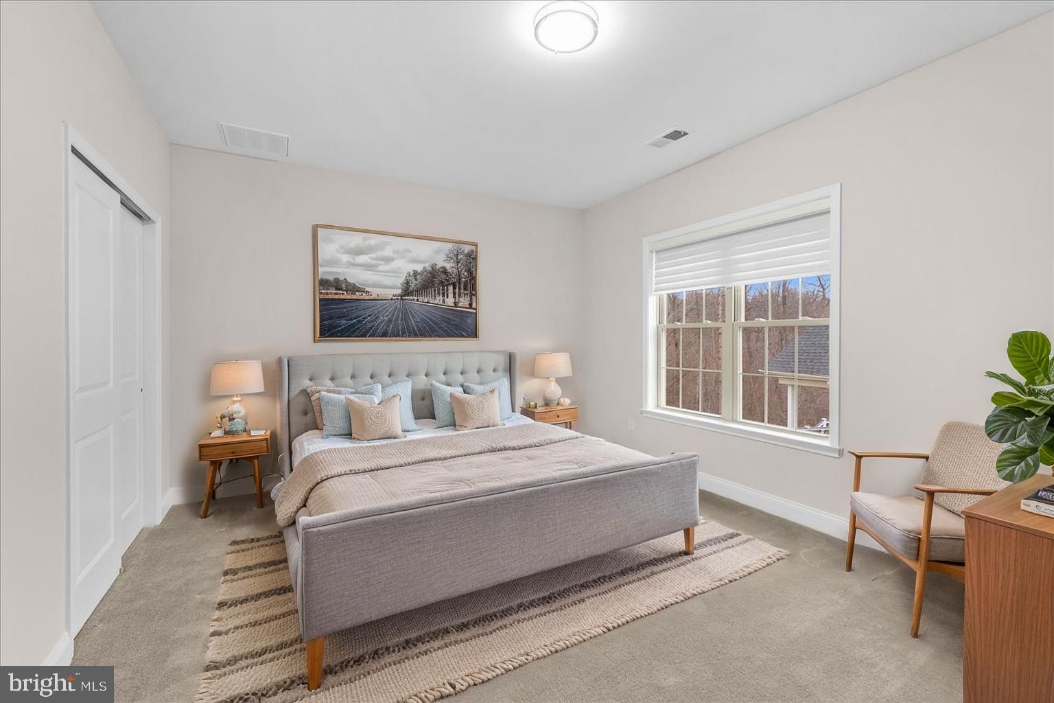 13712 Long Ridge Drive Gainesville, VA 20155 - Photo 42 of 62 a bedroom with a large bed and a chair