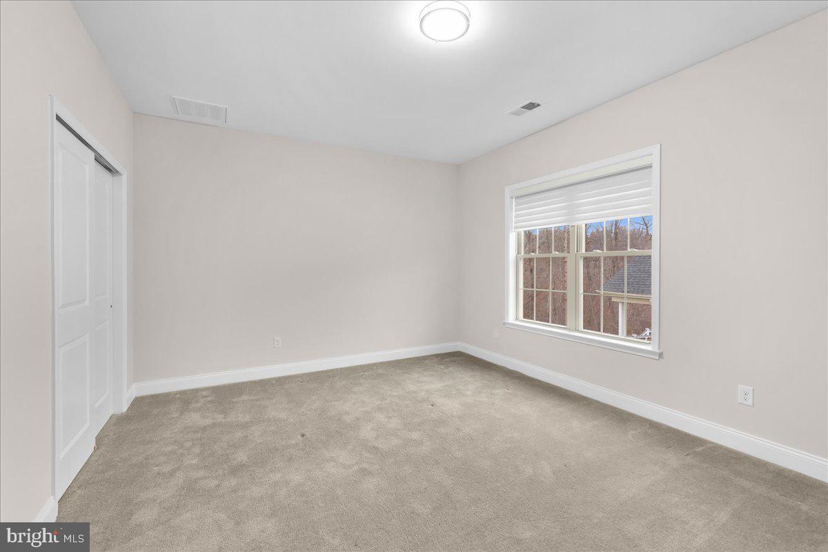 13712 Long Ridge Drive Gainesville, VA 20155 - Photo 43 of 62 a view of an empty room with a window