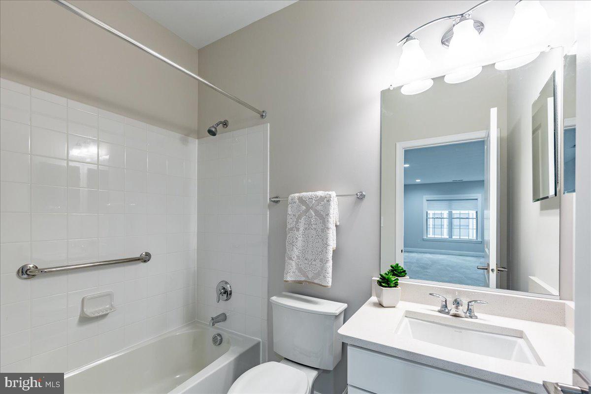 13712 Long Ridge Drive Gainesville, VA 20155 - Photo 44 of 62 a bathroom with a bathtub shower sink and toilet