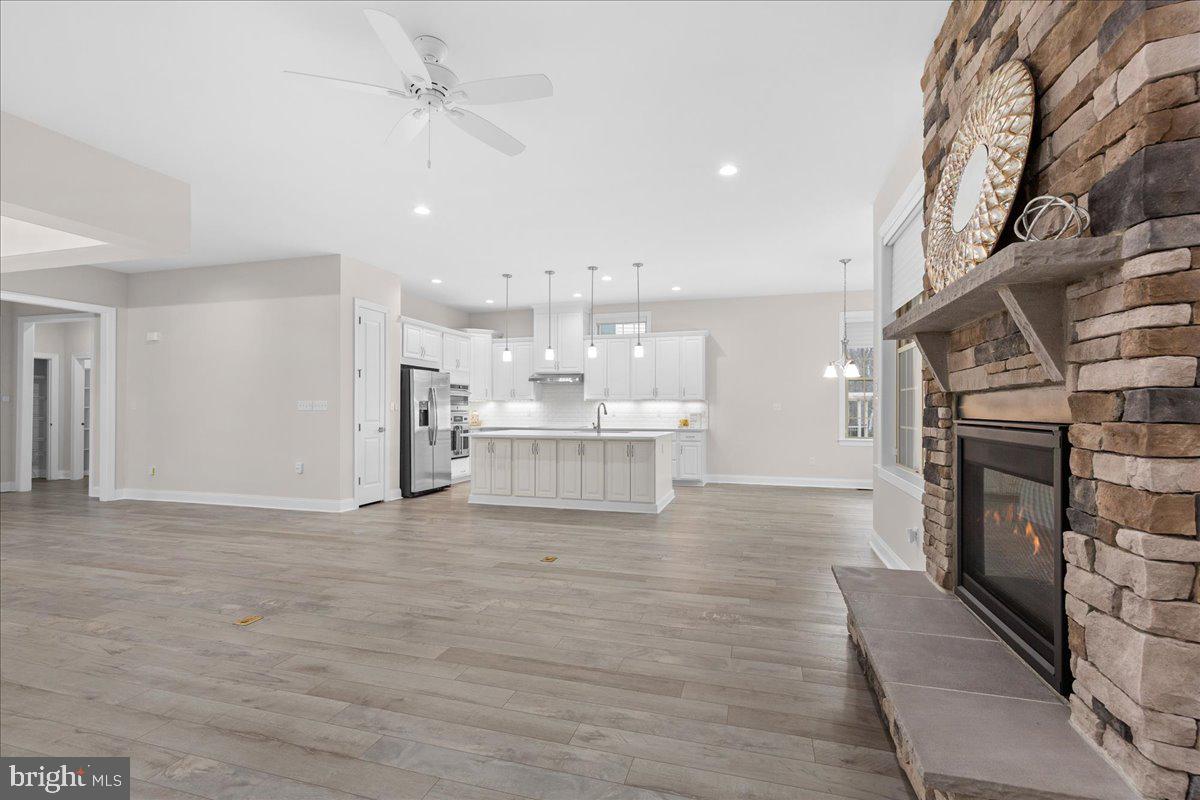 13712 Long Ridge Drive Gainesville, VA 20155 - Photo 8 of 62 a view of a kitchen with a sink and a fireplace