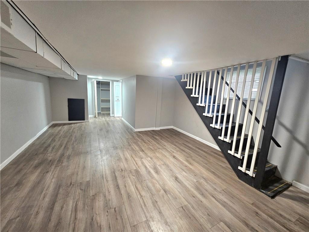 418 Short Street Donora, PA 15033 - Photo 18 of 22 a view of a hallway with wooden floor and staircase