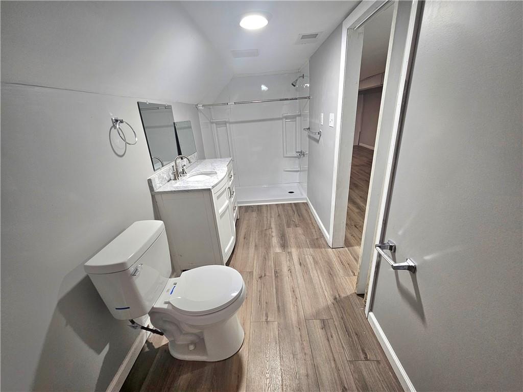 418 Short Street Donora, PA 15033 - Photo 20 of 22 a white toilet sitting next to a small bathroom sink and a mirror