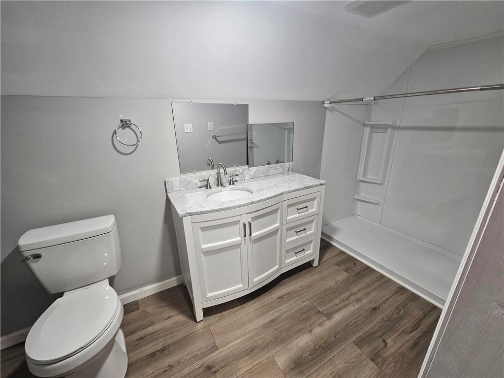 418 Short Street Donora, PA 15033 - Photo 21 of 22 a spacious bathroom with a granite countertop toilet a sink and a shower