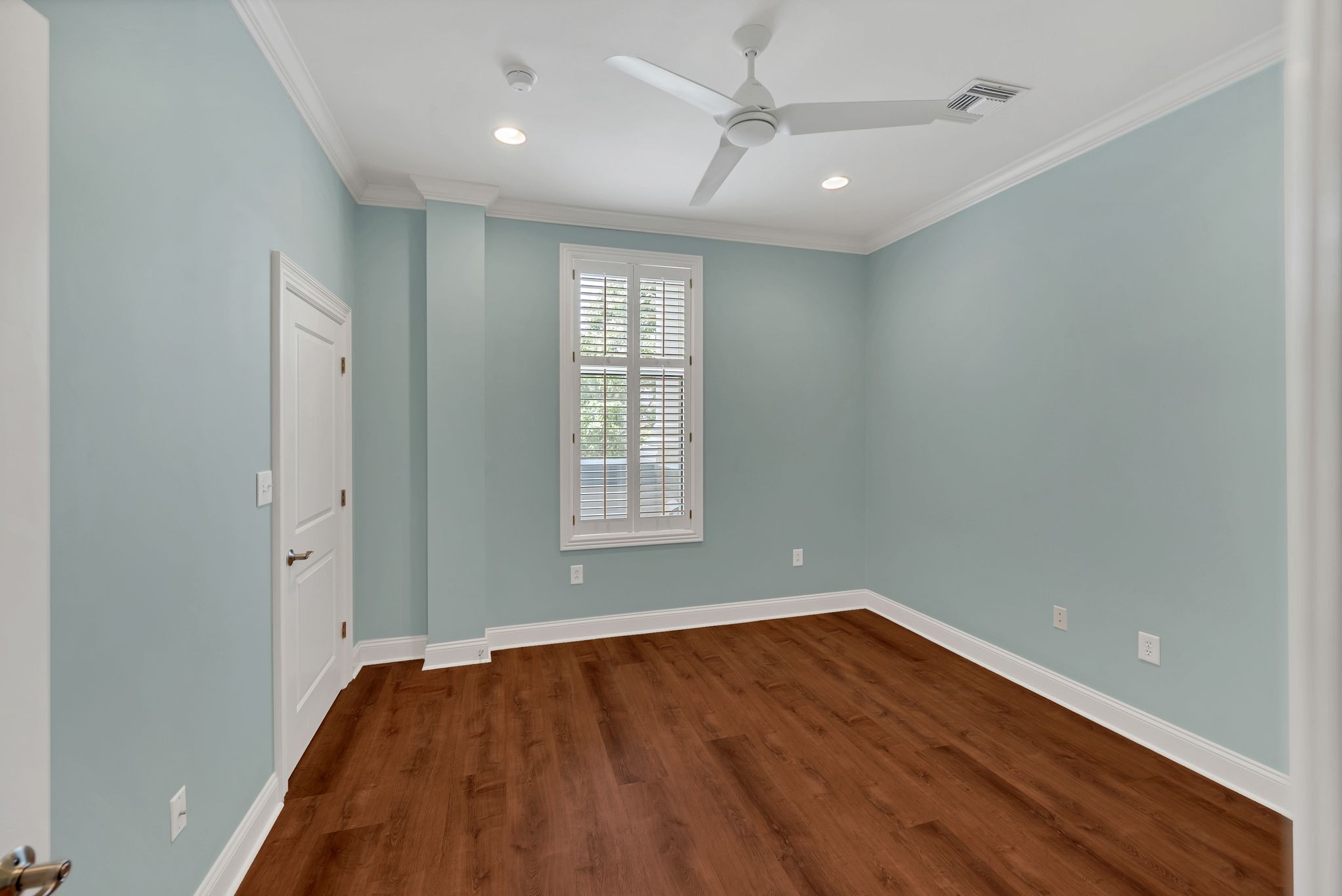 2411 Crestmoor Road, Unit 104 Nashville, TN 37215 - Photo 14 of 32 an empty room with wooden floor and windows