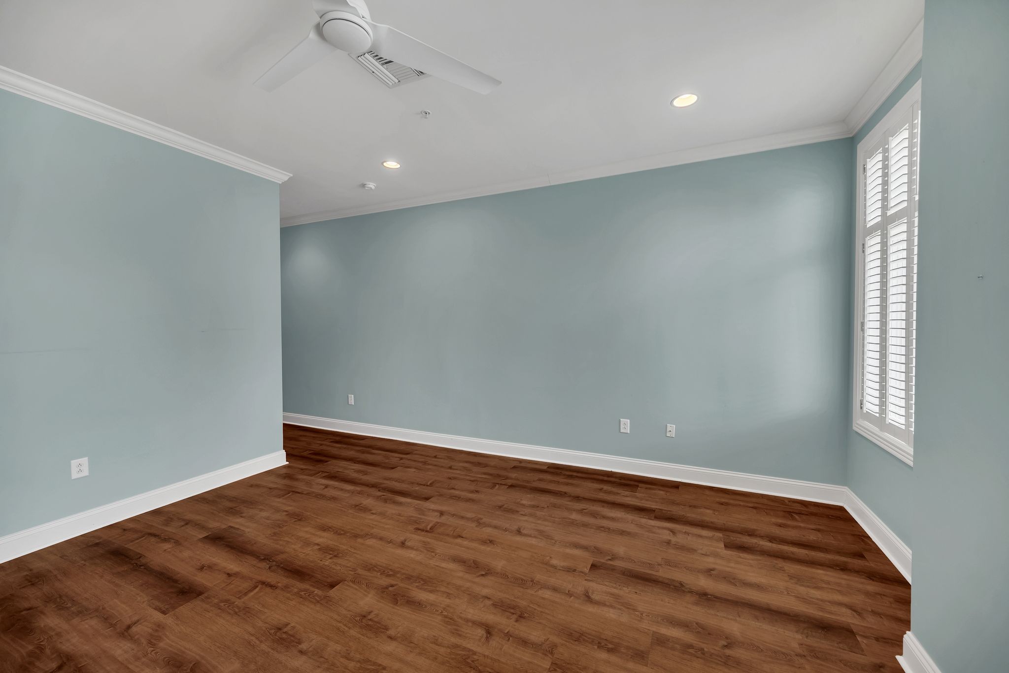 2411 Crestmoor Road, Unit 104 Nashville, TN 37215 - Photo 22 of 32 an empty room with wooden floor and windows