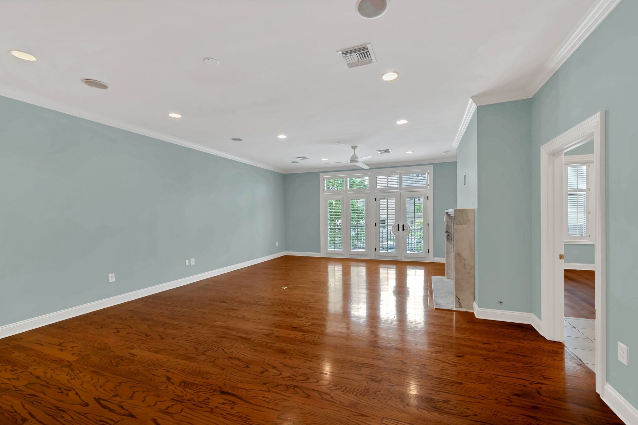 2411 Crestmoor Road, Unit 104 Nashville, TN 37215 - Photo 4 of 32 a view of an empty room with wooden floor and a window