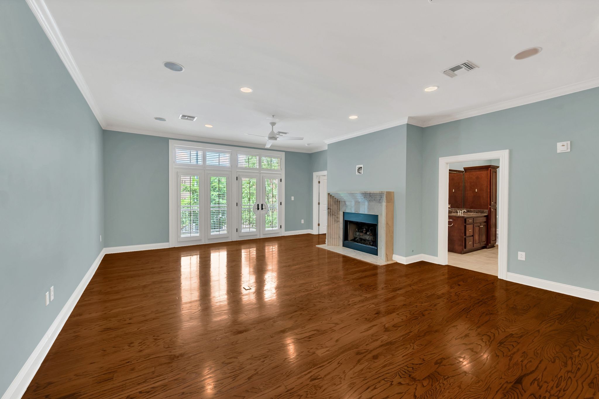 2411 Crestmoor Road, Unit 104 Nashville, TN 37215 - Photo 5 of 32 a view of empty room with wooden floor and fireplace