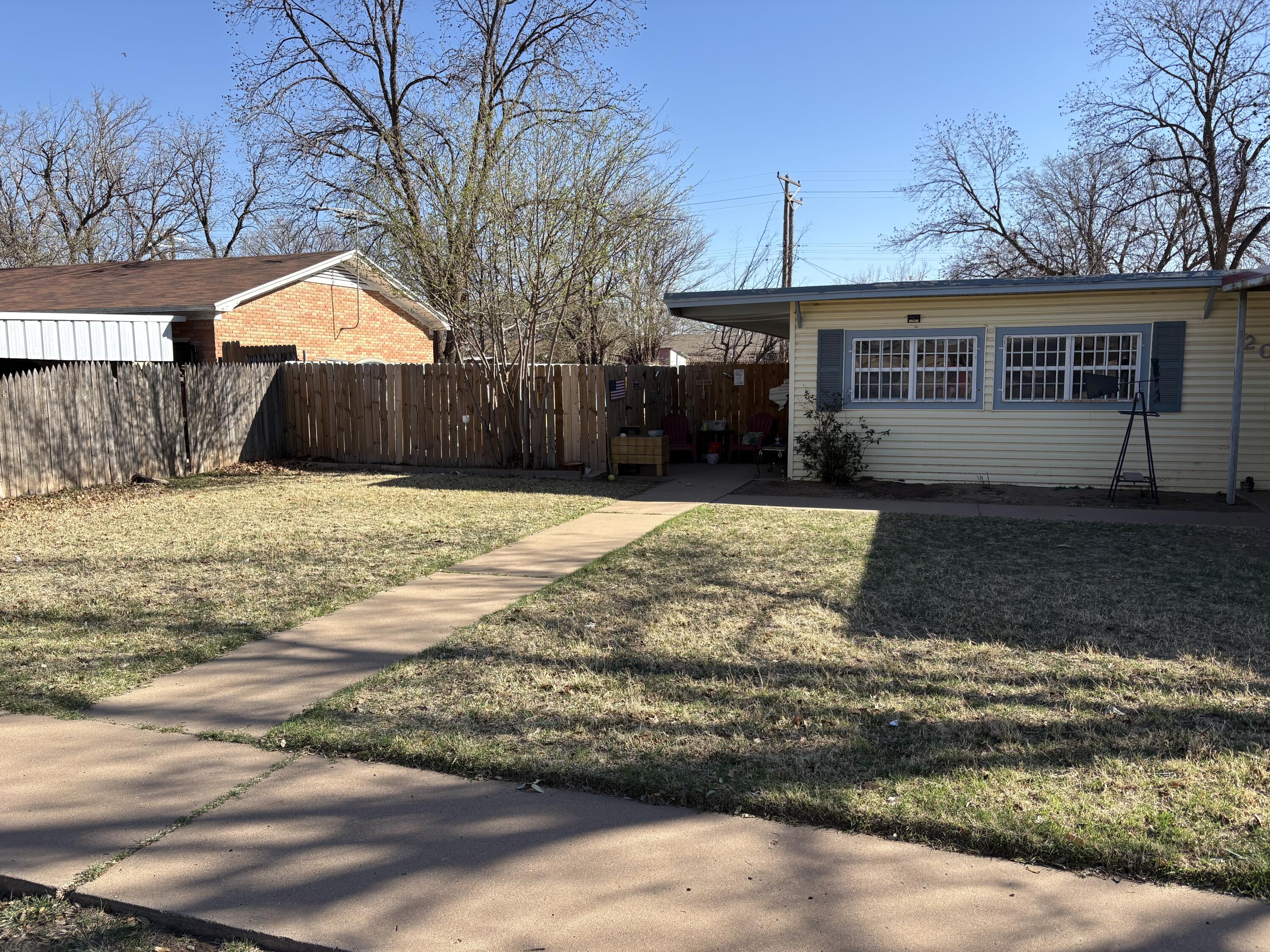 2009 46th Street Lubbock, TX 79412 - Photo 2 of 41 a view of a house with a patio