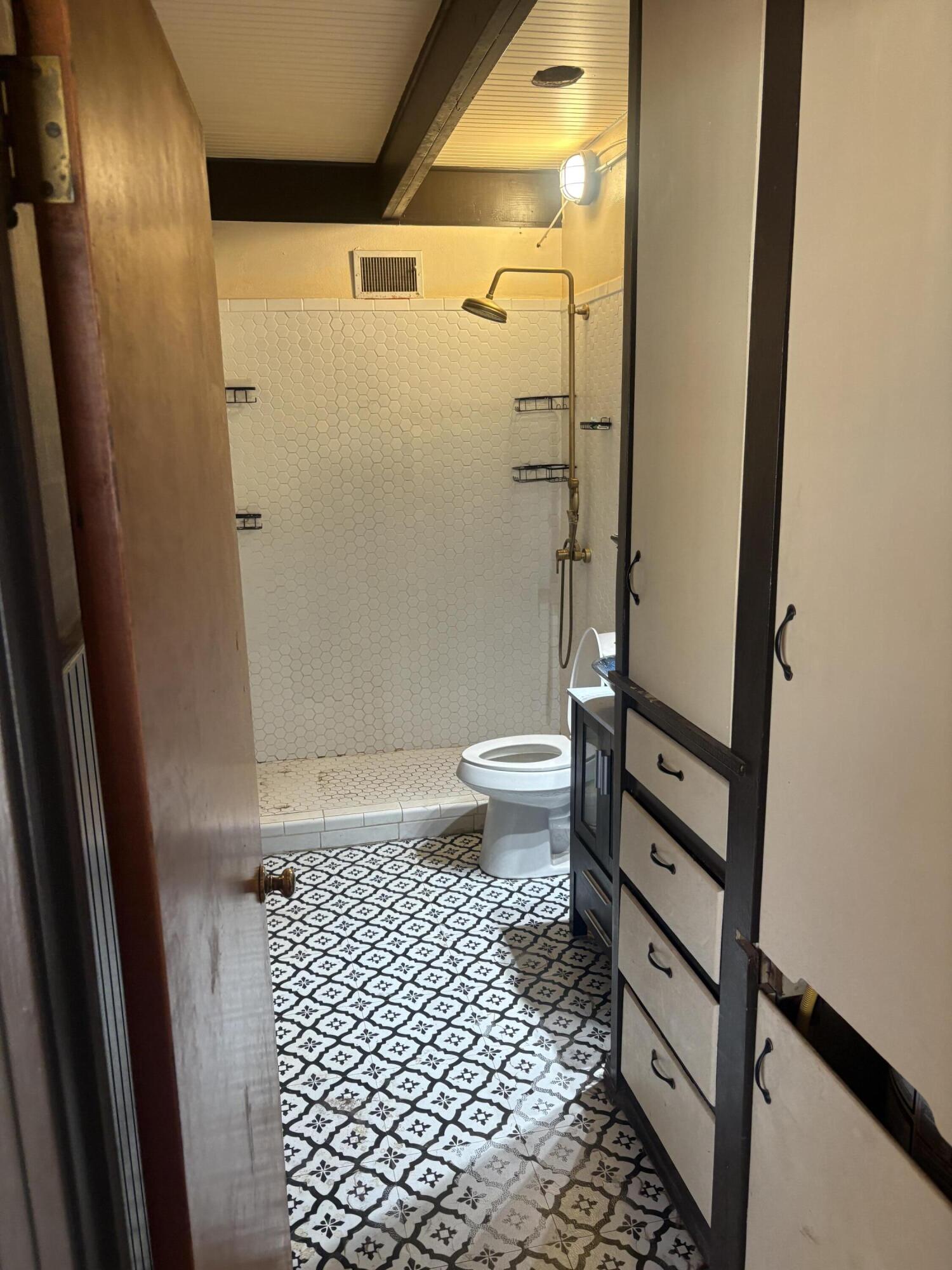 2009 46th Street Lubbock, TX 79412 - Photo 25 of 41 a bathroom with a toilet and a shower