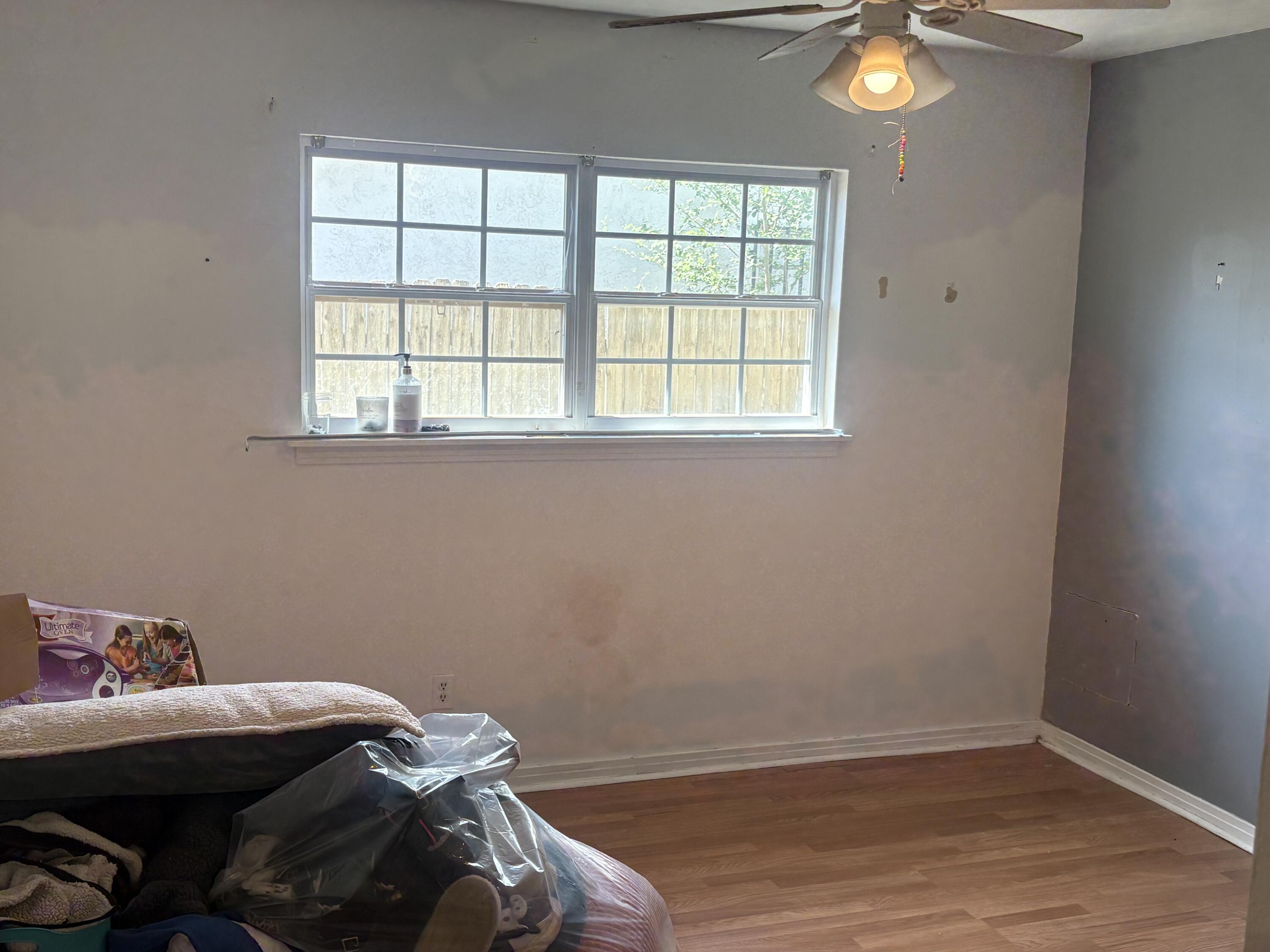 2009 46th Street Lubbock, TX 79412 - Photo 28 of 41 a room with a bed and a window