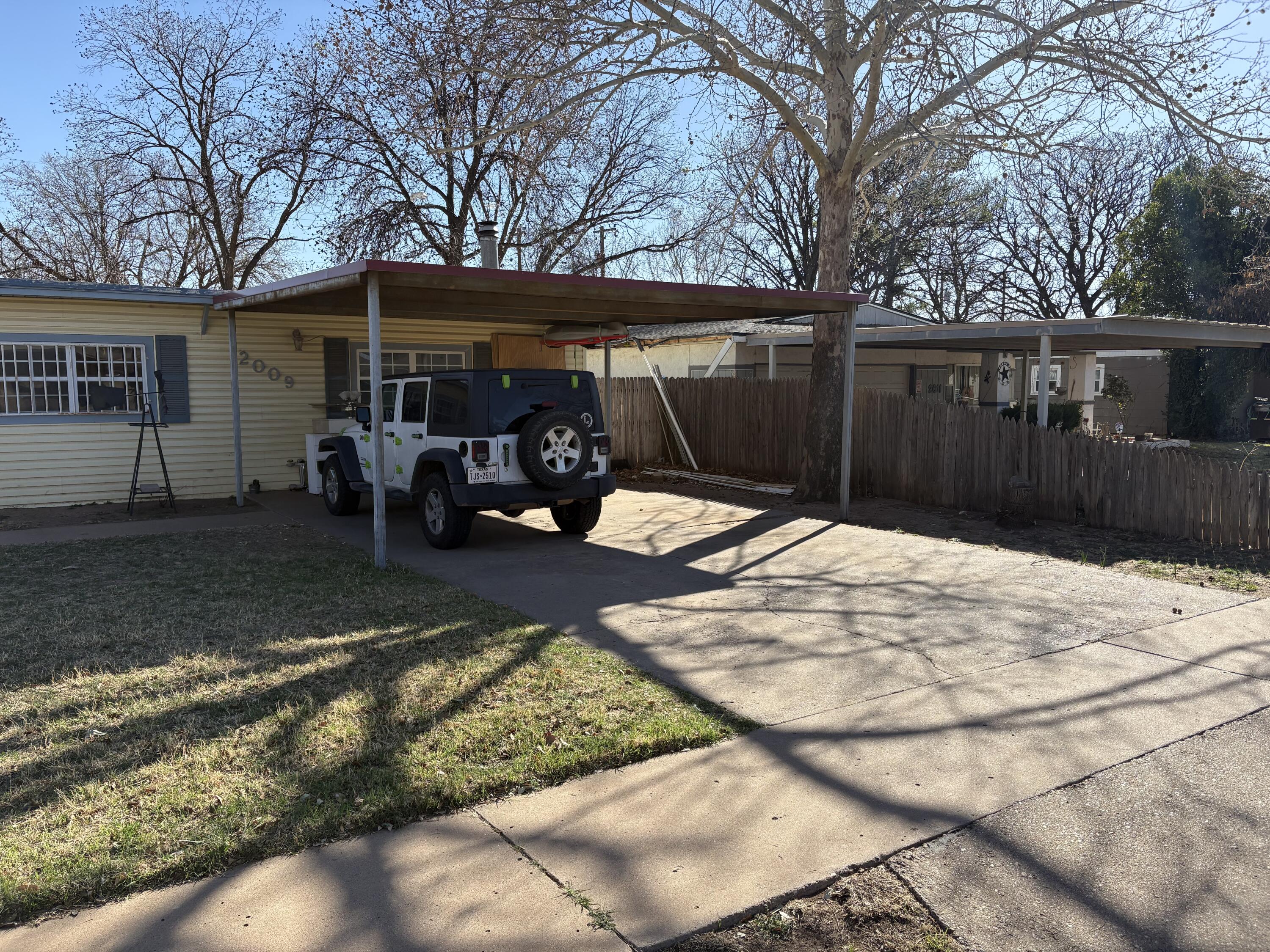 2009 46th Street Lubbock, TX 79412 - Photo 3 of 41 a view of a backyard