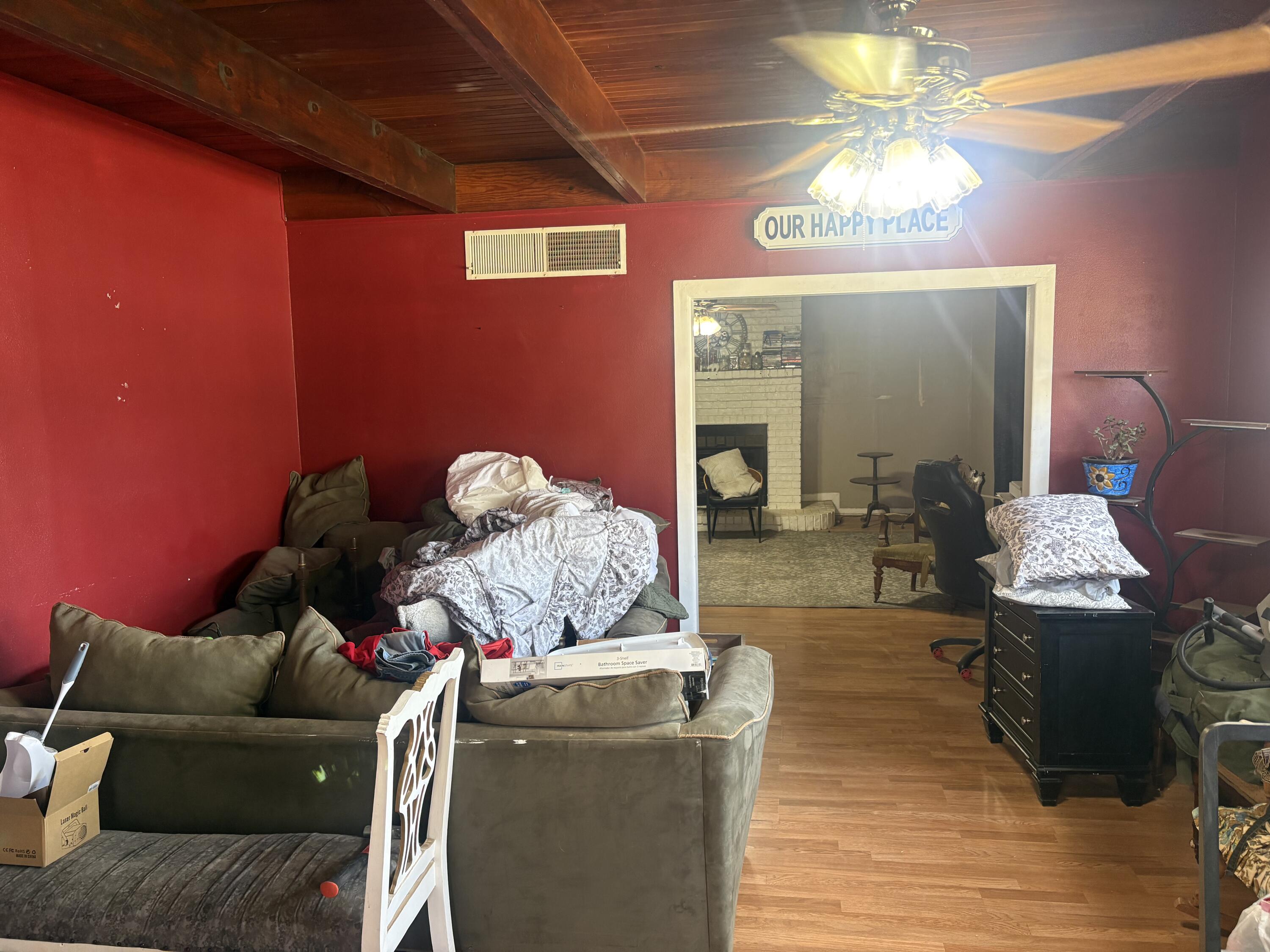 2009 46th Street Lubbock, TX 79412 - Photo 5 of 41 a living room with furniture and a chandelier