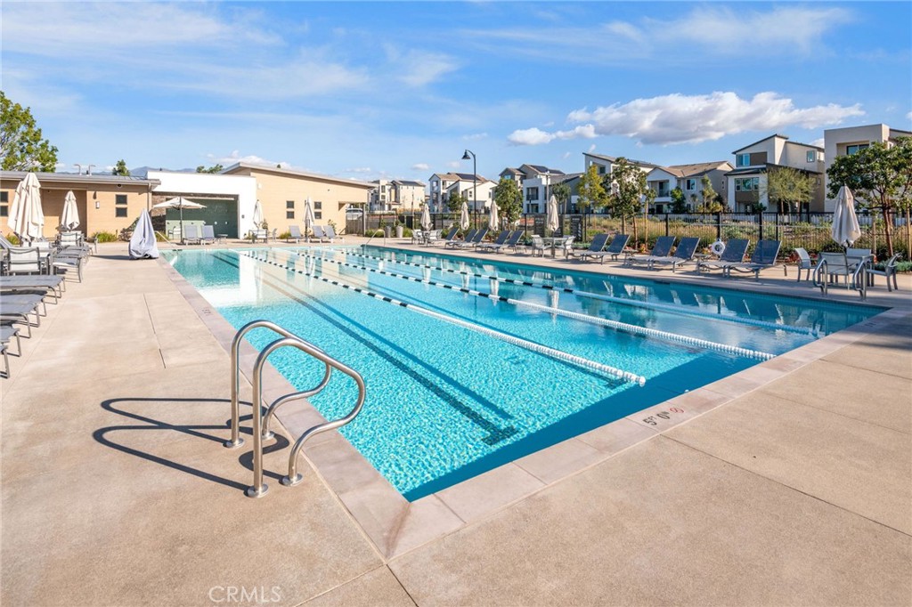 121 Baluster Irvine, CA 92618 - Photo 72 of 80 a view of swimming pool with outdoor seating and a projector
