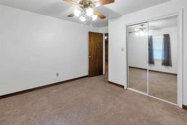 an empty room with a bathroom
